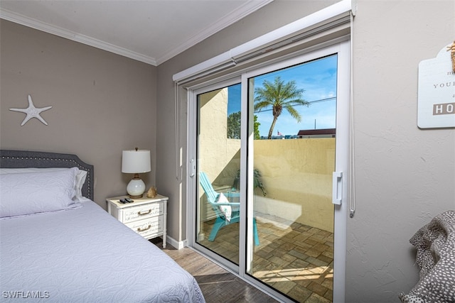 bedroom featuring access to outside, light wood-type flooring, and ornamental molding