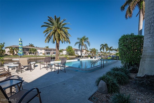 843 SE 46th Ln Unit 1, Cape Coral, FL 33904 - community pool featuring a patio and a residential view