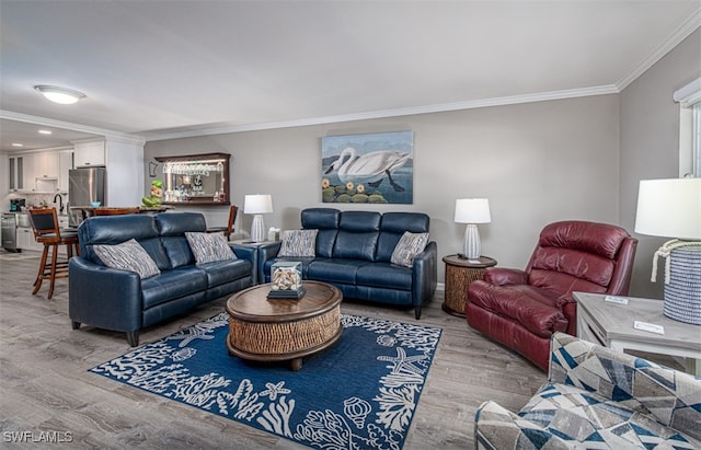 living room featuring light wood-type flooring and ornamental molding