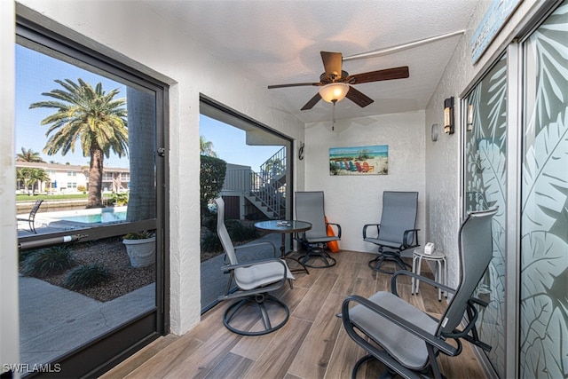 sunroom / solarium with ceiling fan