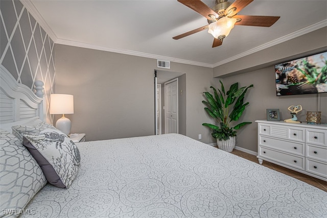 bedroom featuring ceiling fan and crown molding