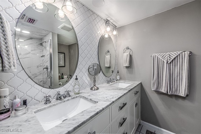 bathroom featuring a shower and vanity