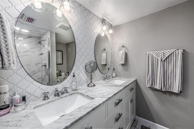 843 SE 46th Ln Unit 1, Cape Coral, FL 33904 - full bath with double vanity, a marble finish shower, and baseboards
