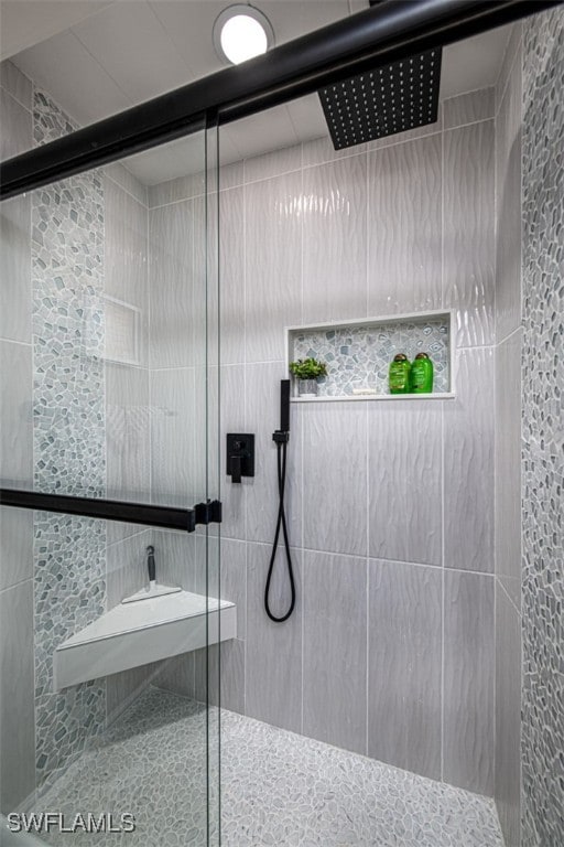 bathroom featuring an enclosed shower