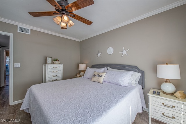 bedroom featuring ceiling fan, hardwood / wood-style floors, and ornamental molding