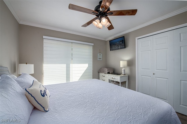 bedroom with a closet, ceiling fan, and crown molding