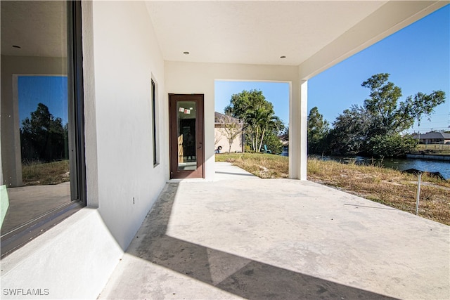 view of patio / terrace featuring a water view