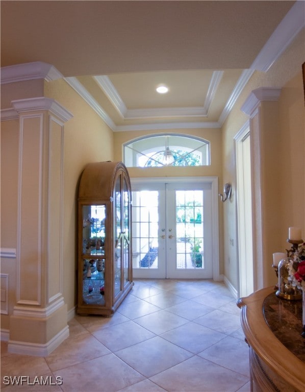 doorway to outside with french doors, ornate columns, and crown molding