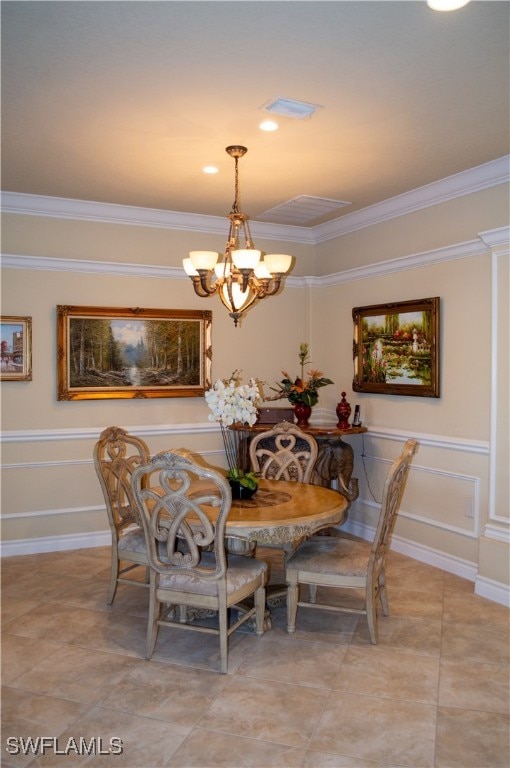 dining space with crown molding and an inviting chandelier