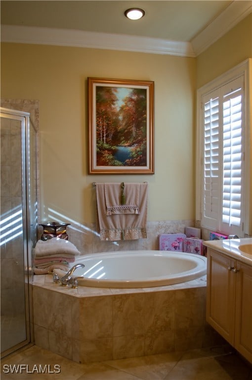 bathroom featuring tile patterned flooring, shower with separate bathtub, vanity, and ornamental molding