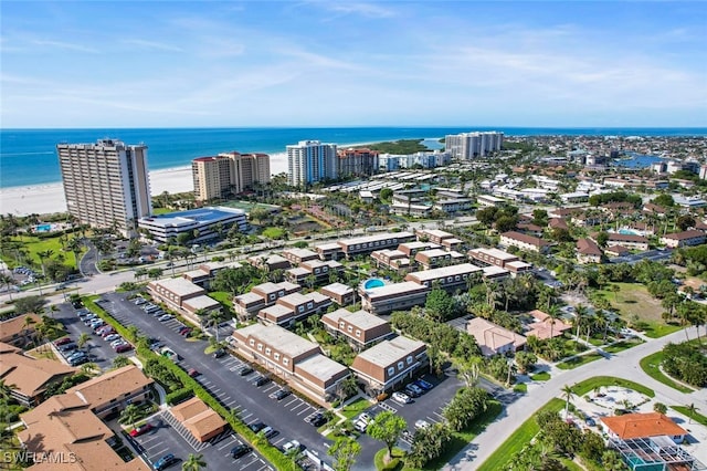 aerial view featuring a water view and a beach view