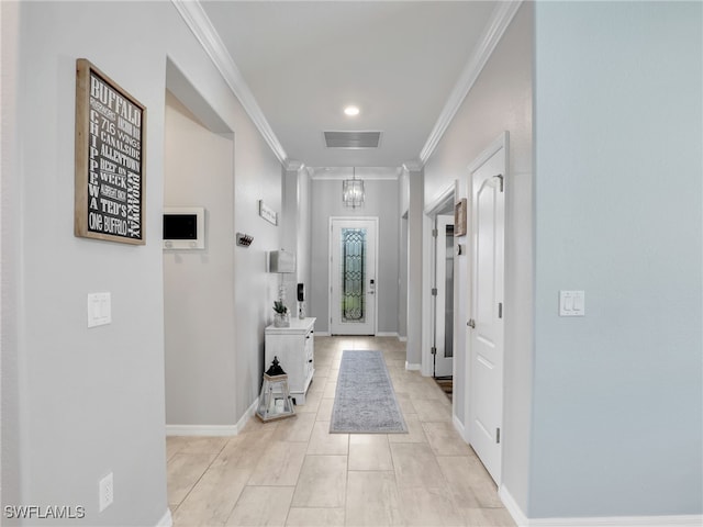 interior space with light tile patterned floors, visible vents, baseboards, and ornamental molding