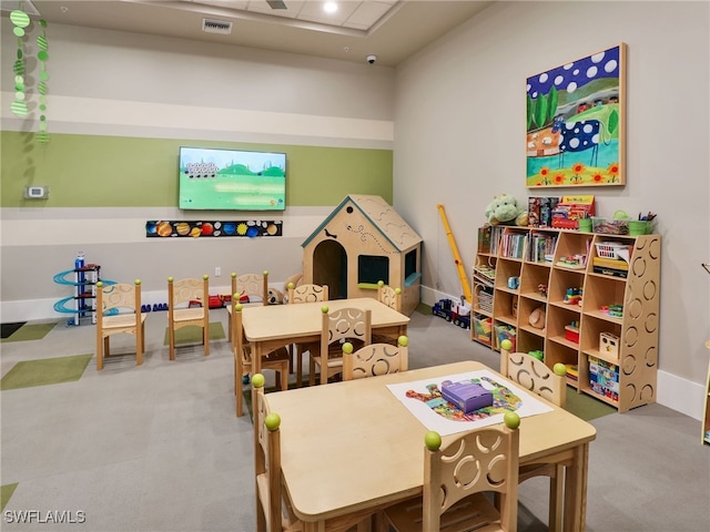 playroom featuring baseboards, visible vents, and carpet floors