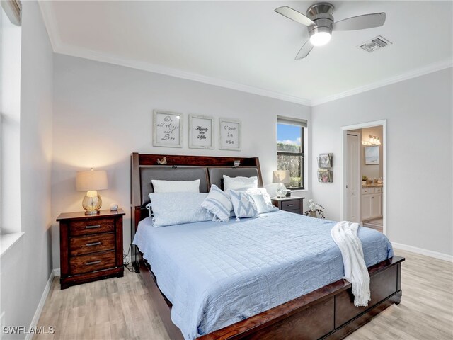 bedroom featuring ceiling fan, light hardwood / wood-style floors, ensuite bathroom, and ornamental molding