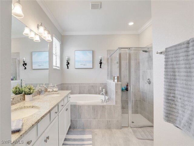 bathroom with crown molding, tile patterned flooring, shower with separate bathtub, and vanity