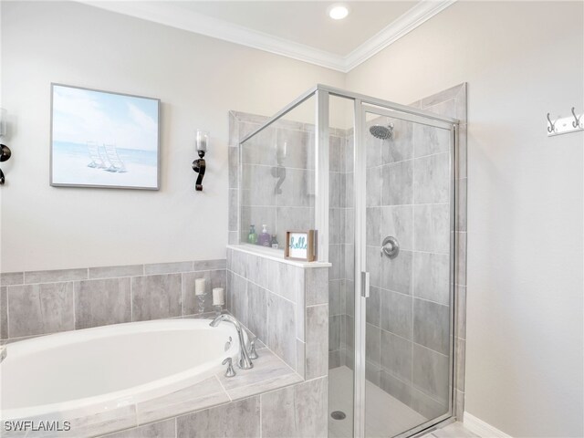 full bathroom with a shower stall, a garden tub, and ornamental molding