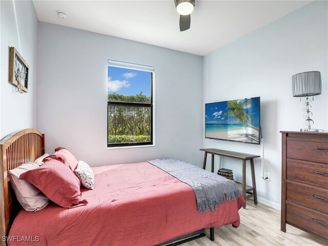 bedroom with light wood-type flooring and ceiling fan