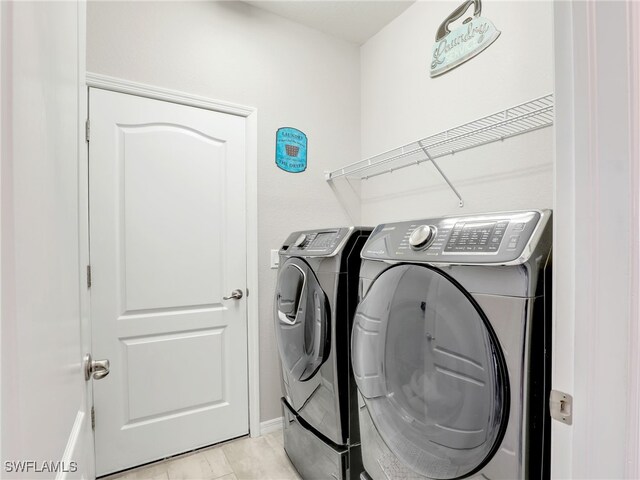 washroom featuring laundry area and independent washer and dryer