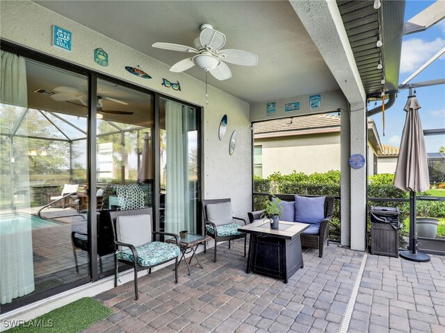 view of patio / terrace featuring an outdoor living space, visible vents, a lanai, and a ceiling fan