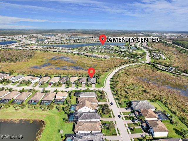 aerial view with a residential view and a water view