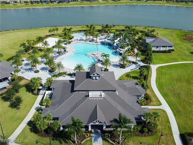 birds eye view of property with a water view