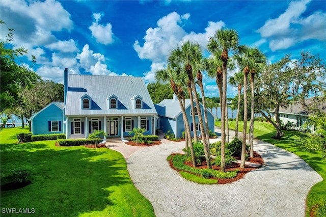 view of front of home with a porch and a front yard