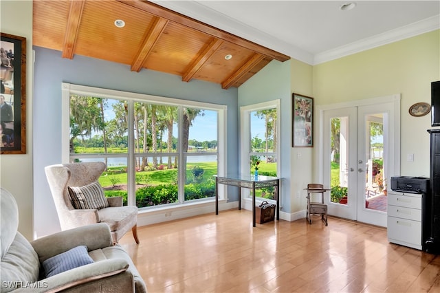 sunroom / solarium featuring vaulted ceiling with beams, wood ceiling, a wealth of natural light, and french doors