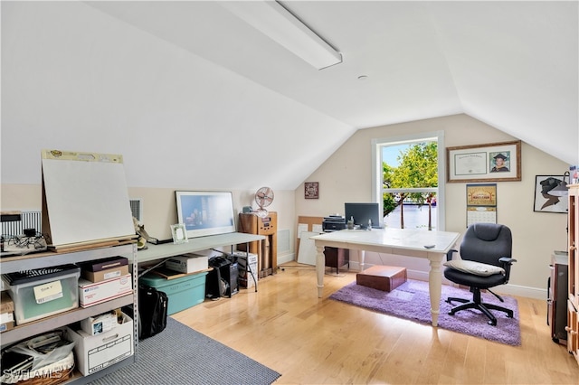 office featuring light hardwood / wood-style floors and lofted ceiling