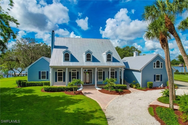 view of front of home featuring a front lawn and covered porch