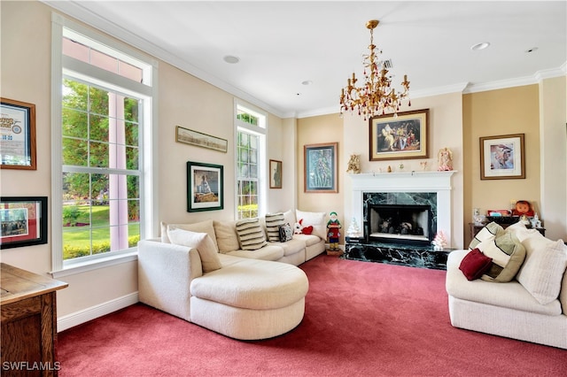 carpeted living room featuring a healthy amount of sunlight, a premium fireplace, ornamental molding, and an inviting chandelier