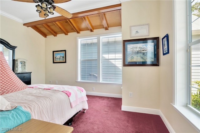 carpeted bedroom with ceiling fan, lofted ceiling with beams, wooden ceiling, and ornamental molding