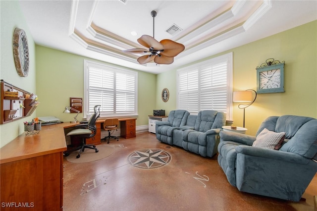 office featuring a raised ceiling, ceiling fan, and crown molding