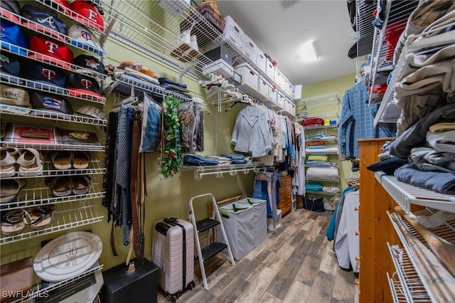 spacious closet featuring hardwood / wood-style floors