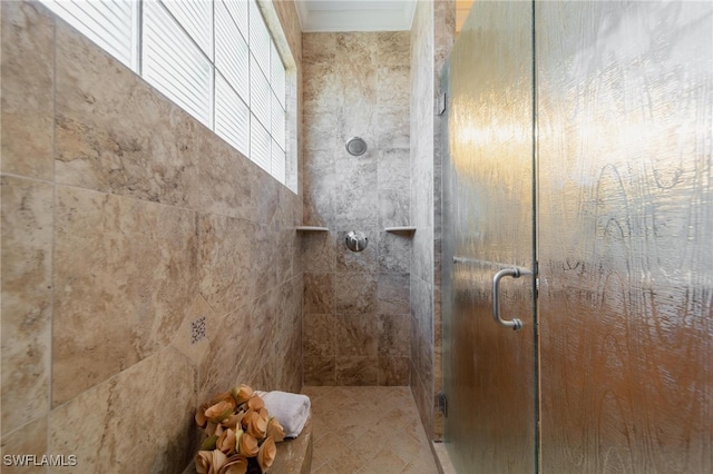 bathroom with a shower with door