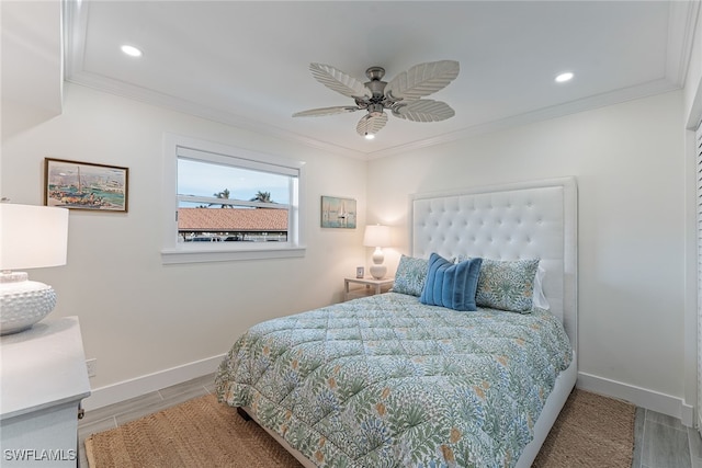 bedroom with ceiling fan and ornamental molding