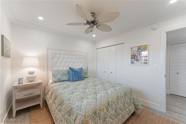 bedroom featuring ceiling fan, a closet, and crown molding