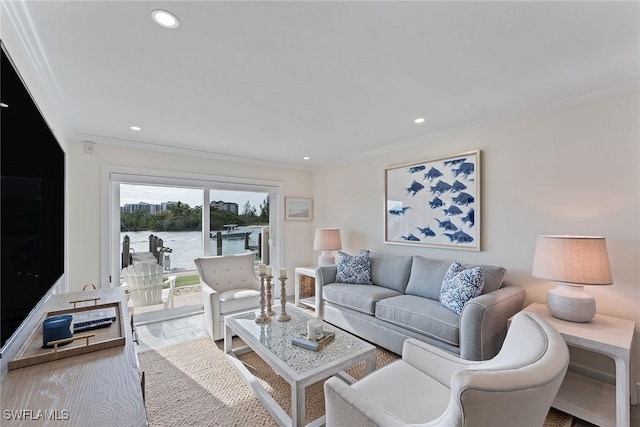 living room with a water view and ornamental molding