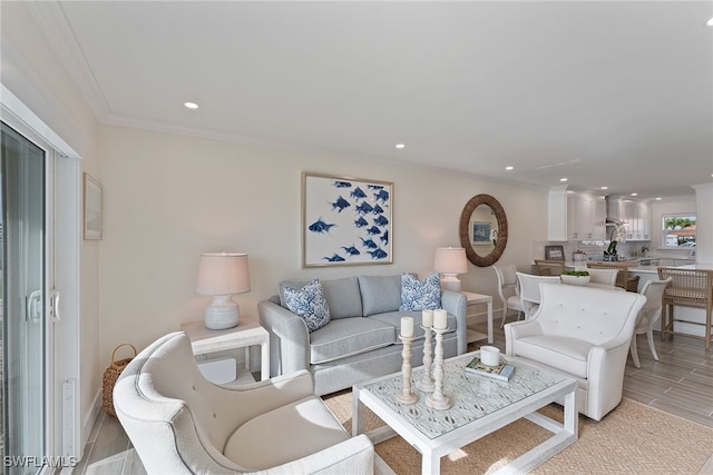 living room featuring crown molding