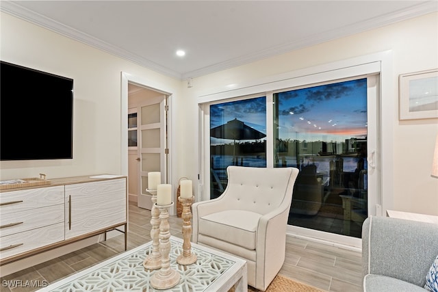 sitting room featuring ornamental molding