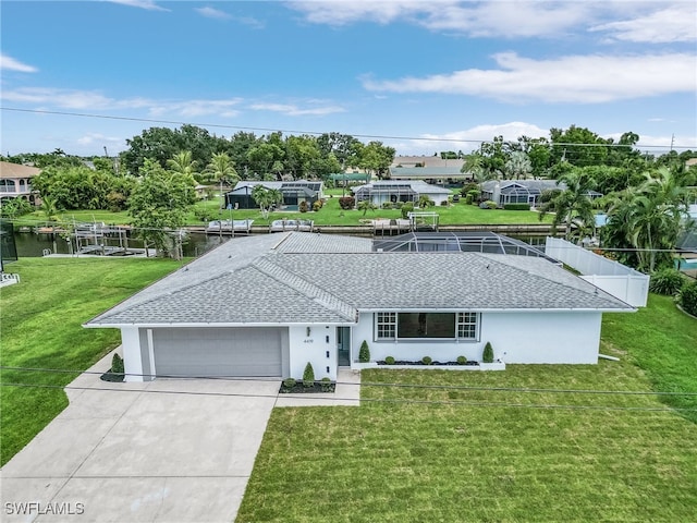 ranch-style house with a front yard, a water view, and glass enclosure