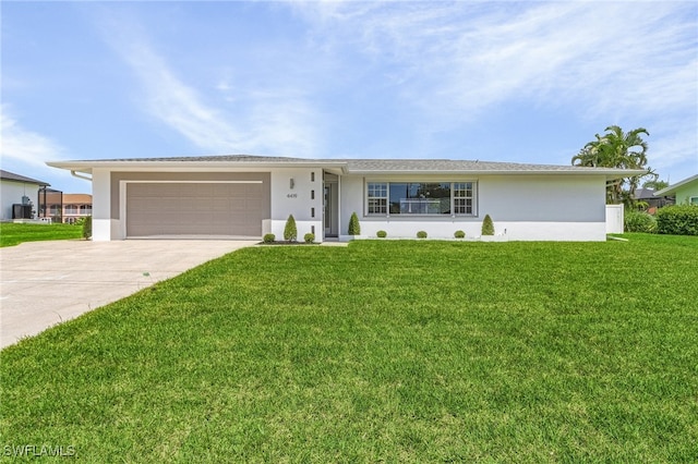 ranch-style house featuring a front yard and a garage