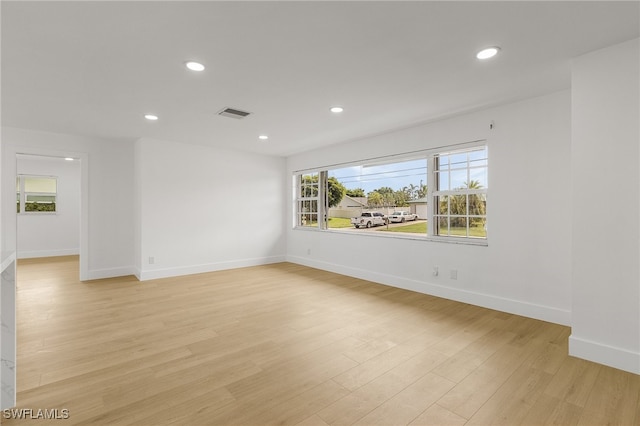 spare room featuring light hardwood / wood-style flooring