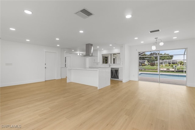 unfurnished living room featuring light hardwood / wood-style floors