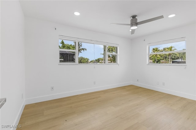 unfurnished room with ceiling fan and light wood-type flooring