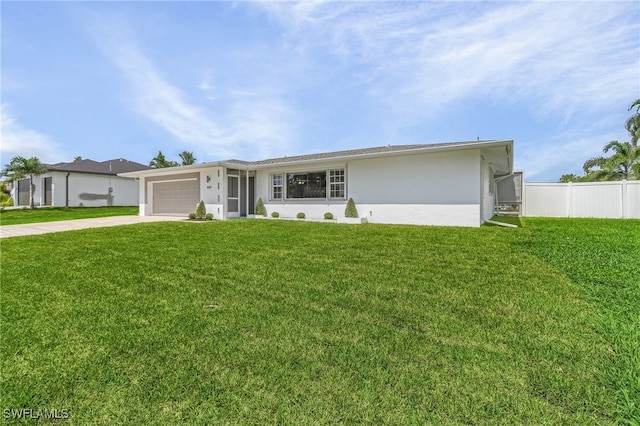 ranch-style home with a front yard and a garage