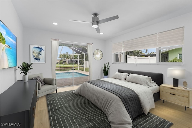 bedroom featuring access to exterior, ceiling fan, and light hardwood / wood-style floors