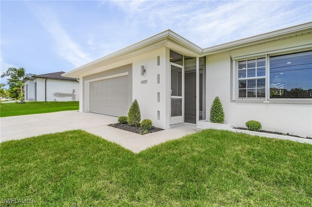 ranch-style house with a garage and a front lawn