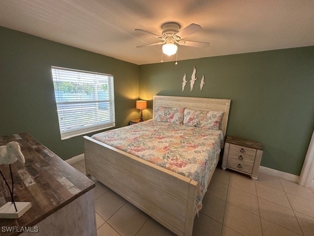 bedroom with ceiling fan and light tile patterned floors