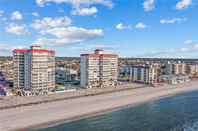 aerial view featuring a water view and a beach view