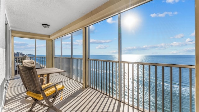 sunroom with a water view